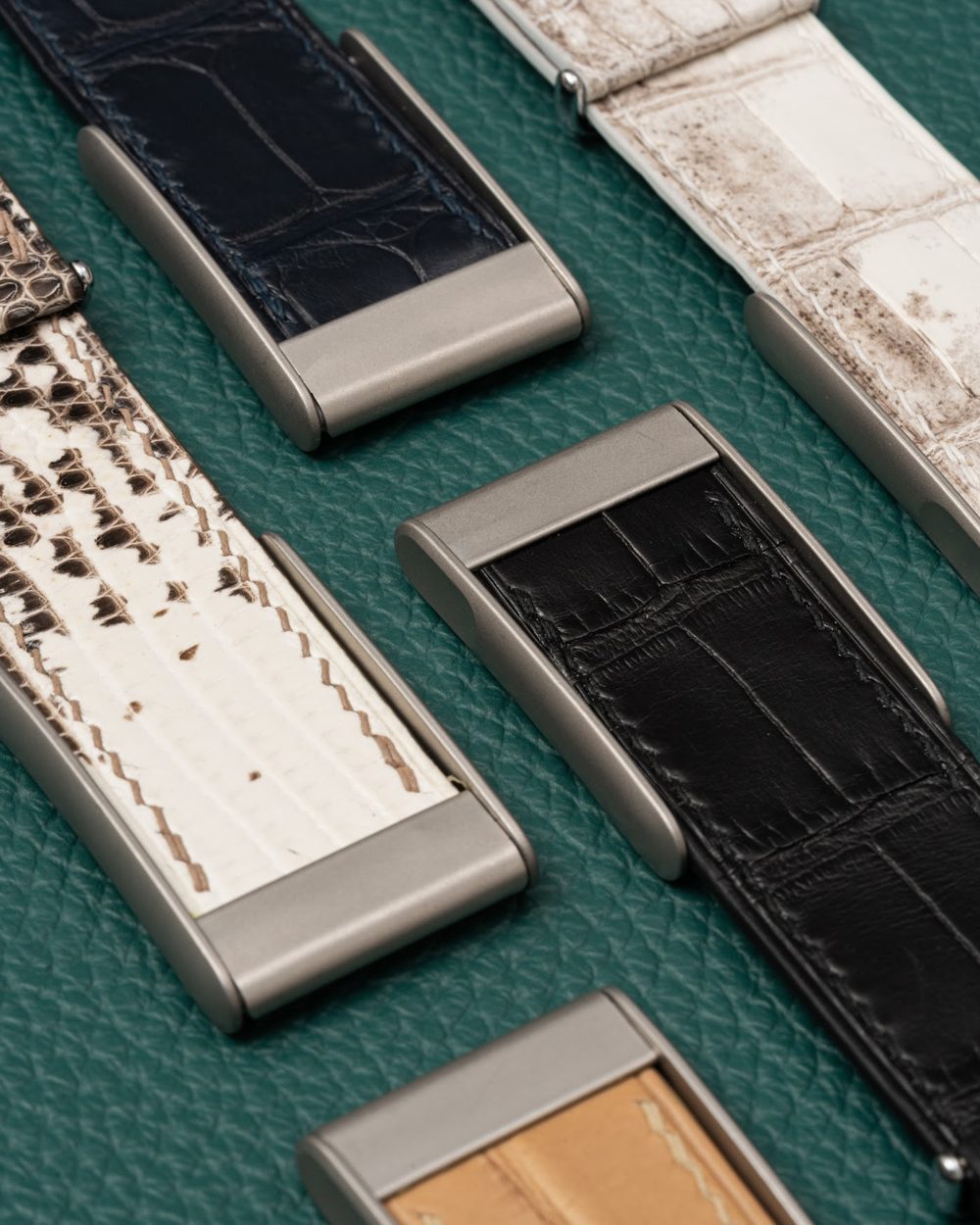 Noire Leathers crocodile straps laid out in the workshop
