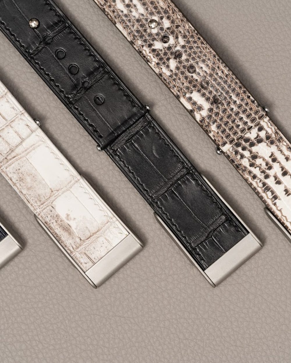 Noire Leathers crocodile straps laid out in the workshop