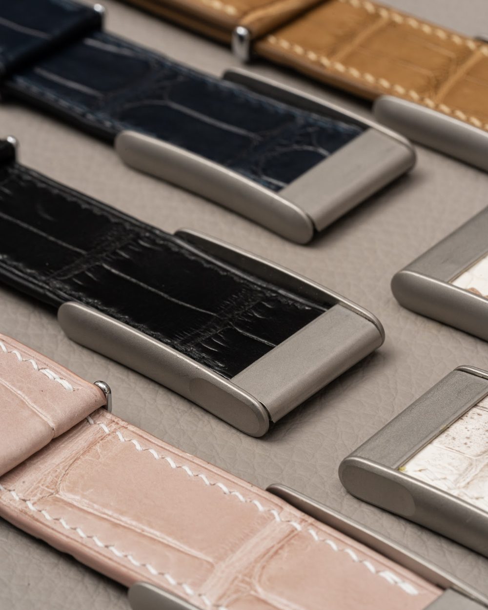 Noire Leathers crocodile straps laid out in the workshop