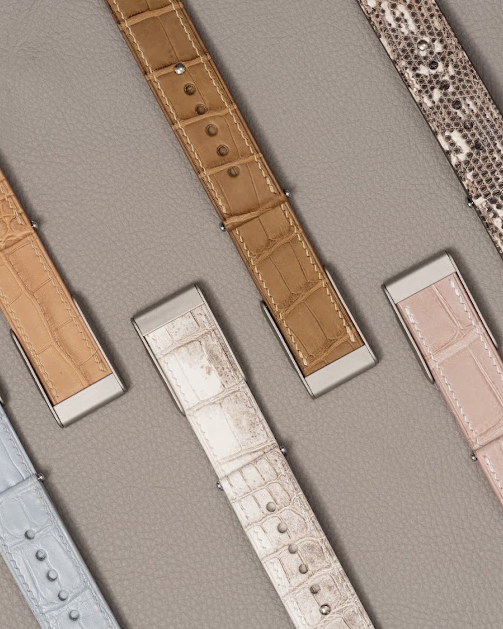 Noire Leathers crocodile straps laid out in the workshop
